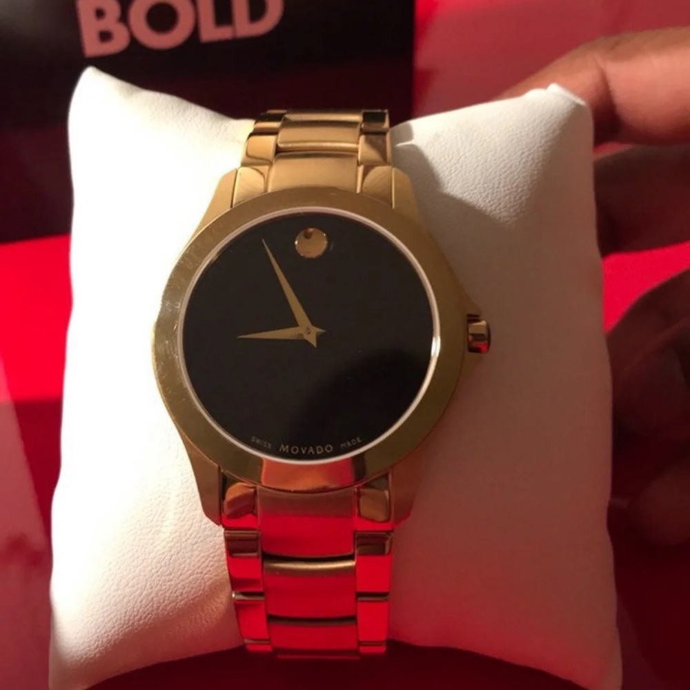 New black and gold movado watch